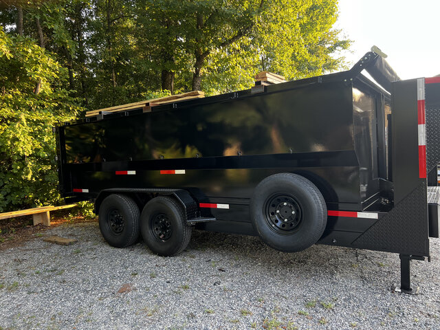 Dump trailer loaded with lumber for a haul-off