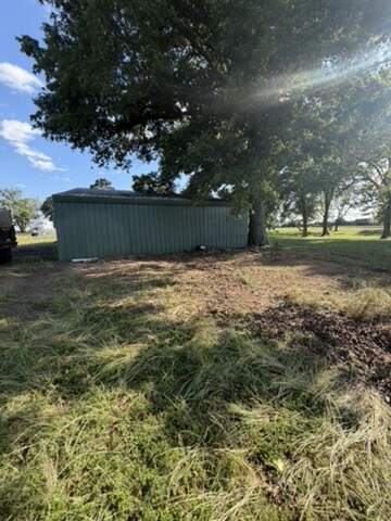 Shed in a field before demolition