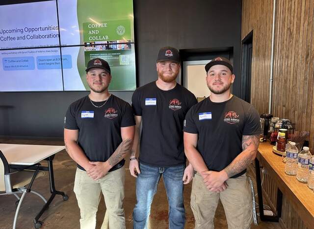 Kyran, Matt, and Tannis at a Russellville community event