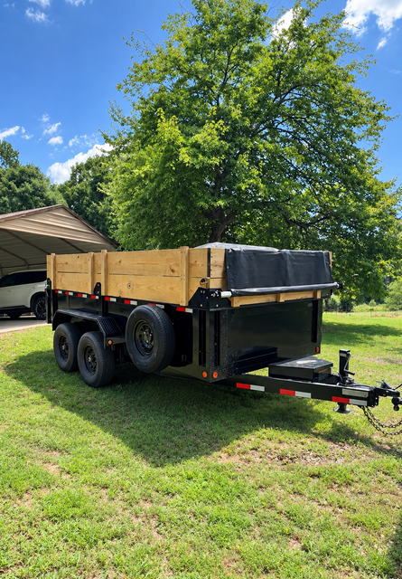 Wood-sided dump trailer ready for a job