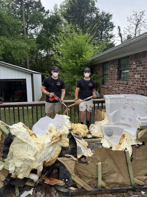 Crew with a fully demolished hot tub