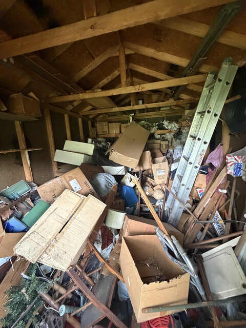 Garage packed with boxes and items before a cleanout