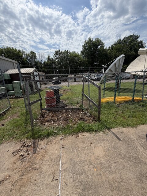 Commercial yard cleanout with cable reels and barrels