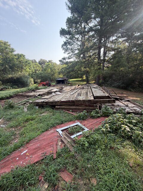 Collapsed deck boards and debris after demolition