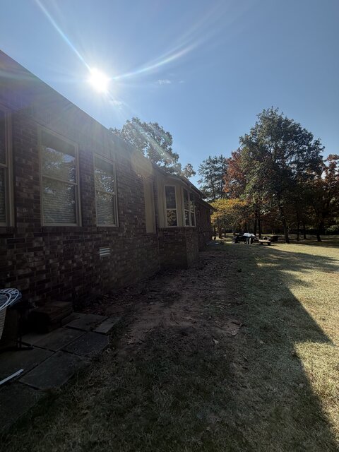 Side yard at a property before deck demolition